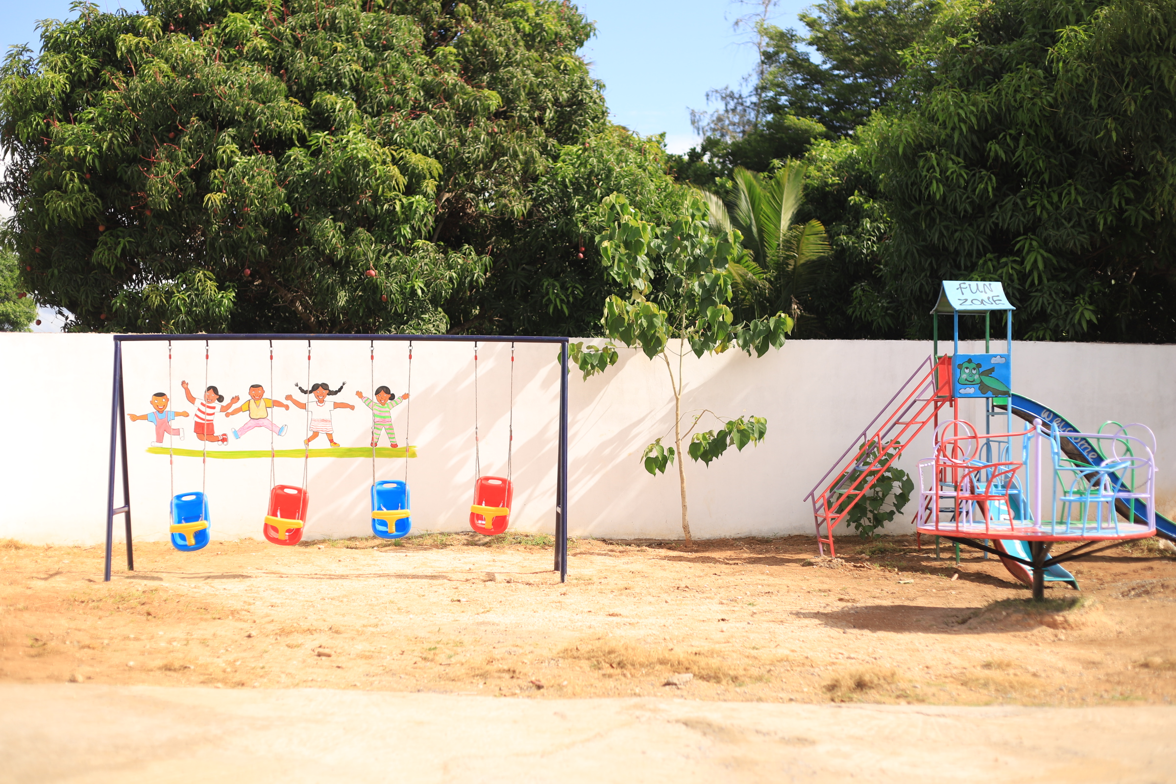 Children running across the school field