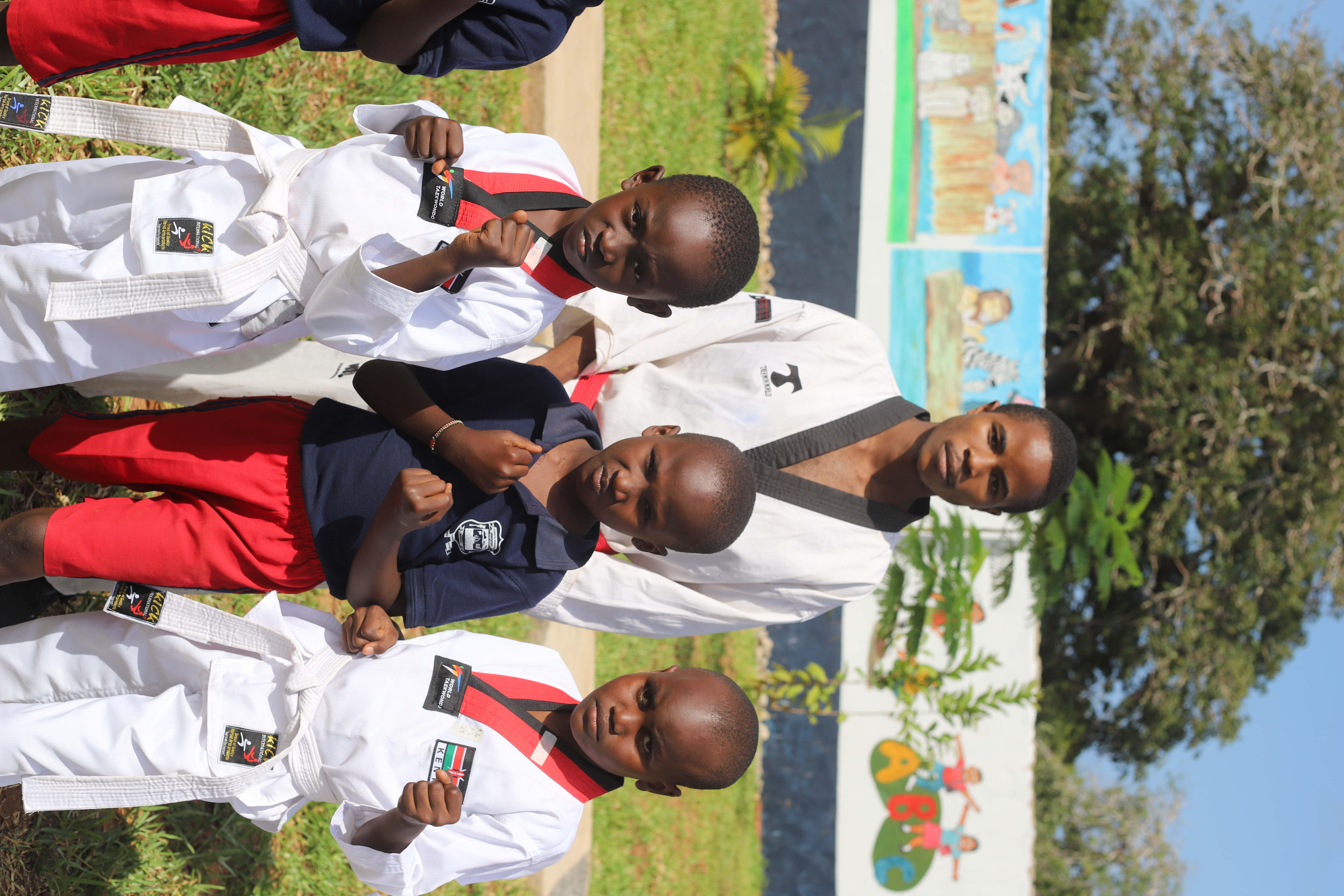 Children running and playing on the school lawn